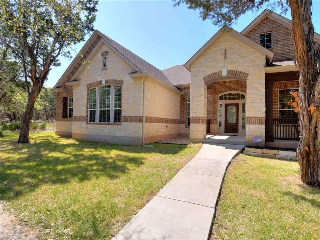 a view of house with swimming pool outdoor seating