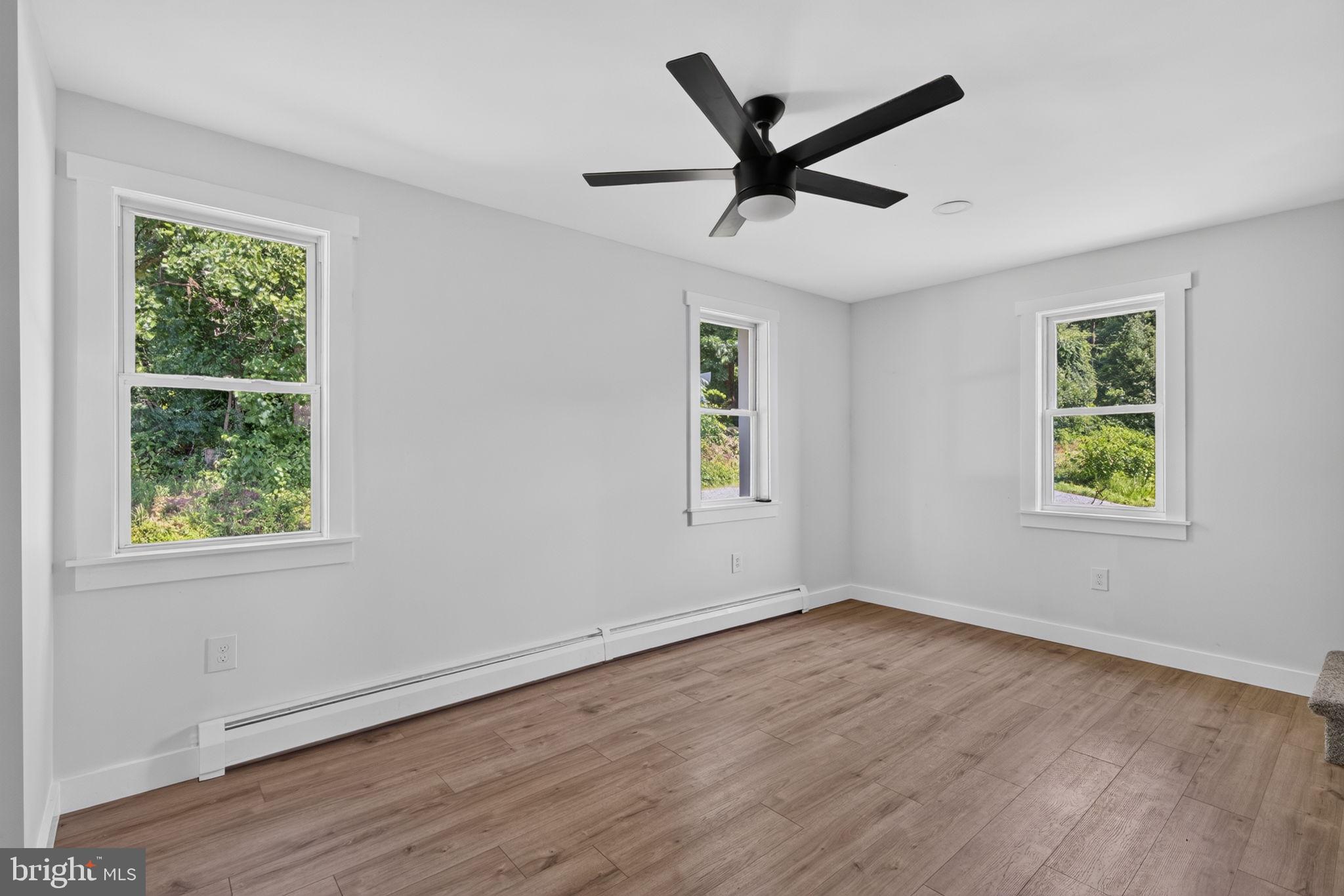 140 Limekiln Road Reading, PA 19606 - Photo 17 of 37 a view of a big room with wooden floor chandelier and windows
