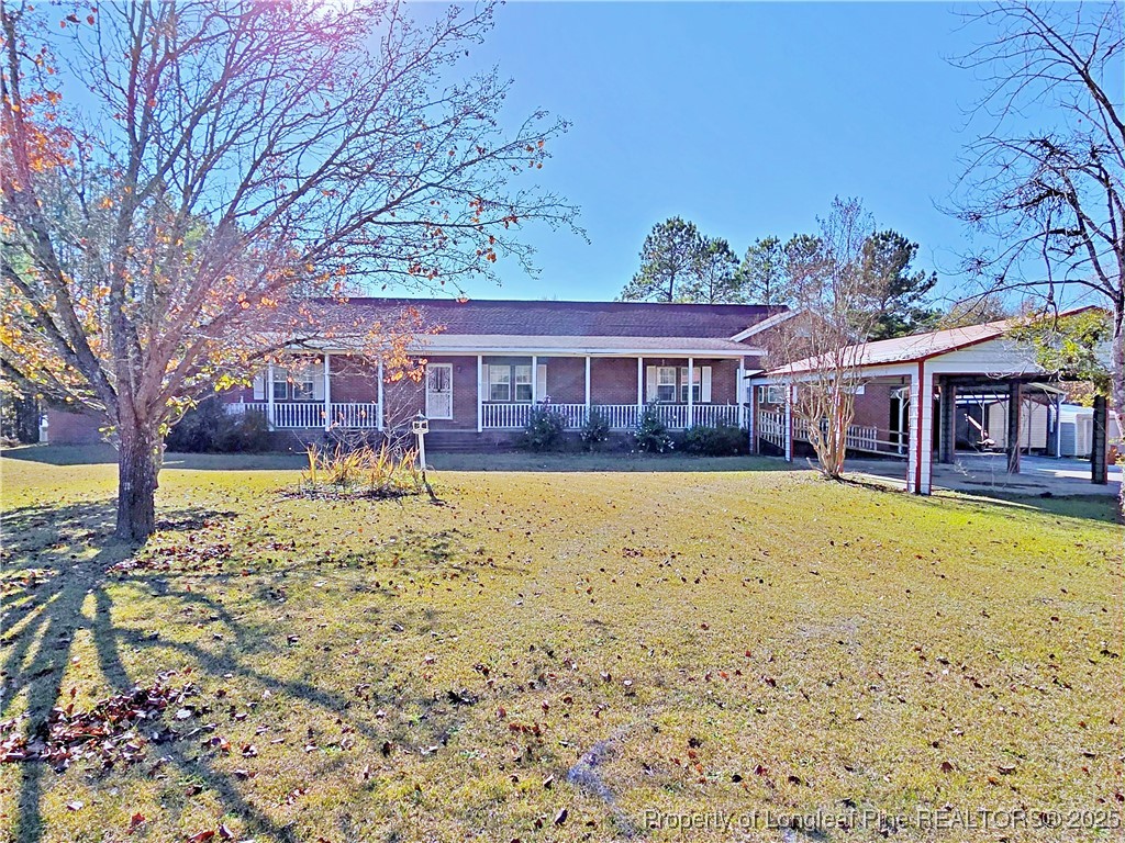 1459 Crawford Wright Road Raeford, NC 28376 - Photo 32 of 50 front view of a house with a yard