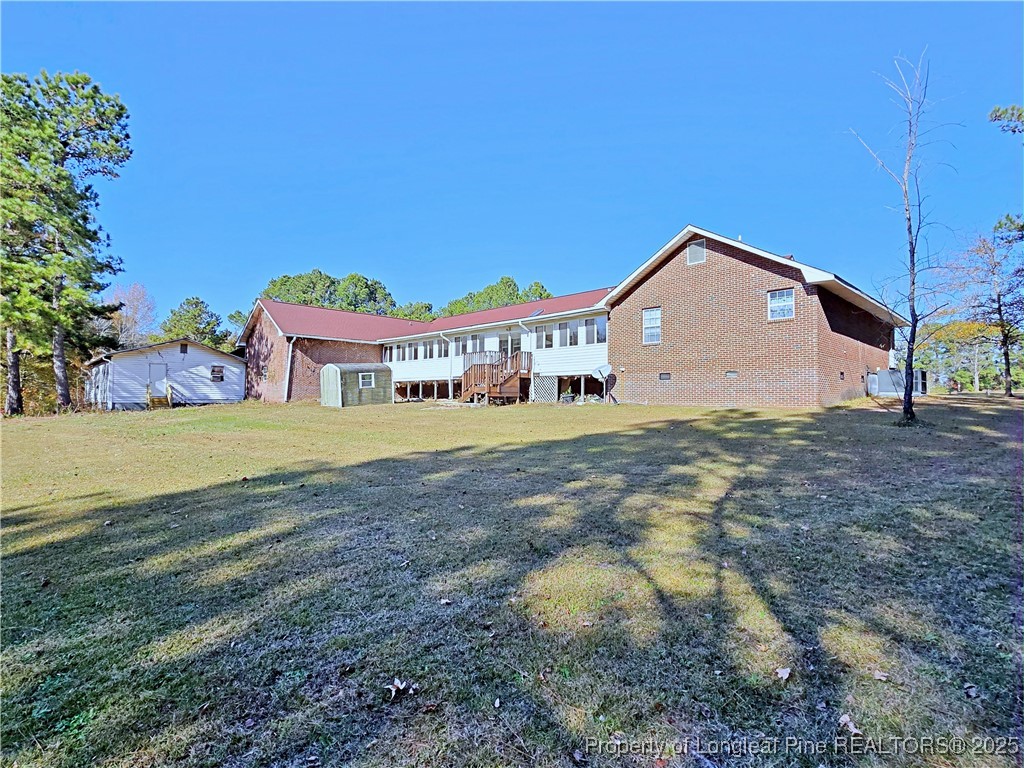 1459 Crawford Wright Road Raeford, NC 28376 - Photo 43 of 50 a front view of a house with a yard