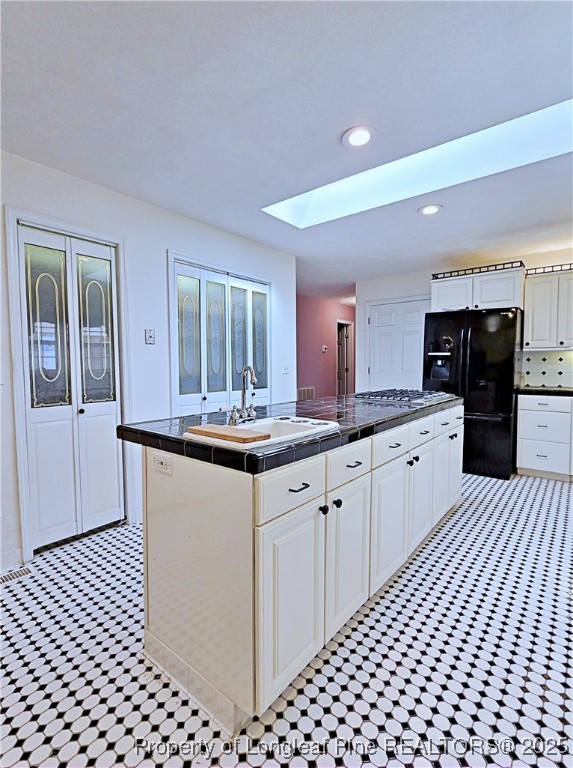 1459 Crawford Wright Road Raeford, NC 28376 - Photo 7 of 50 a large kitchen with granite countertop a sink and dishwasher a refrigerator with wooden cabinets