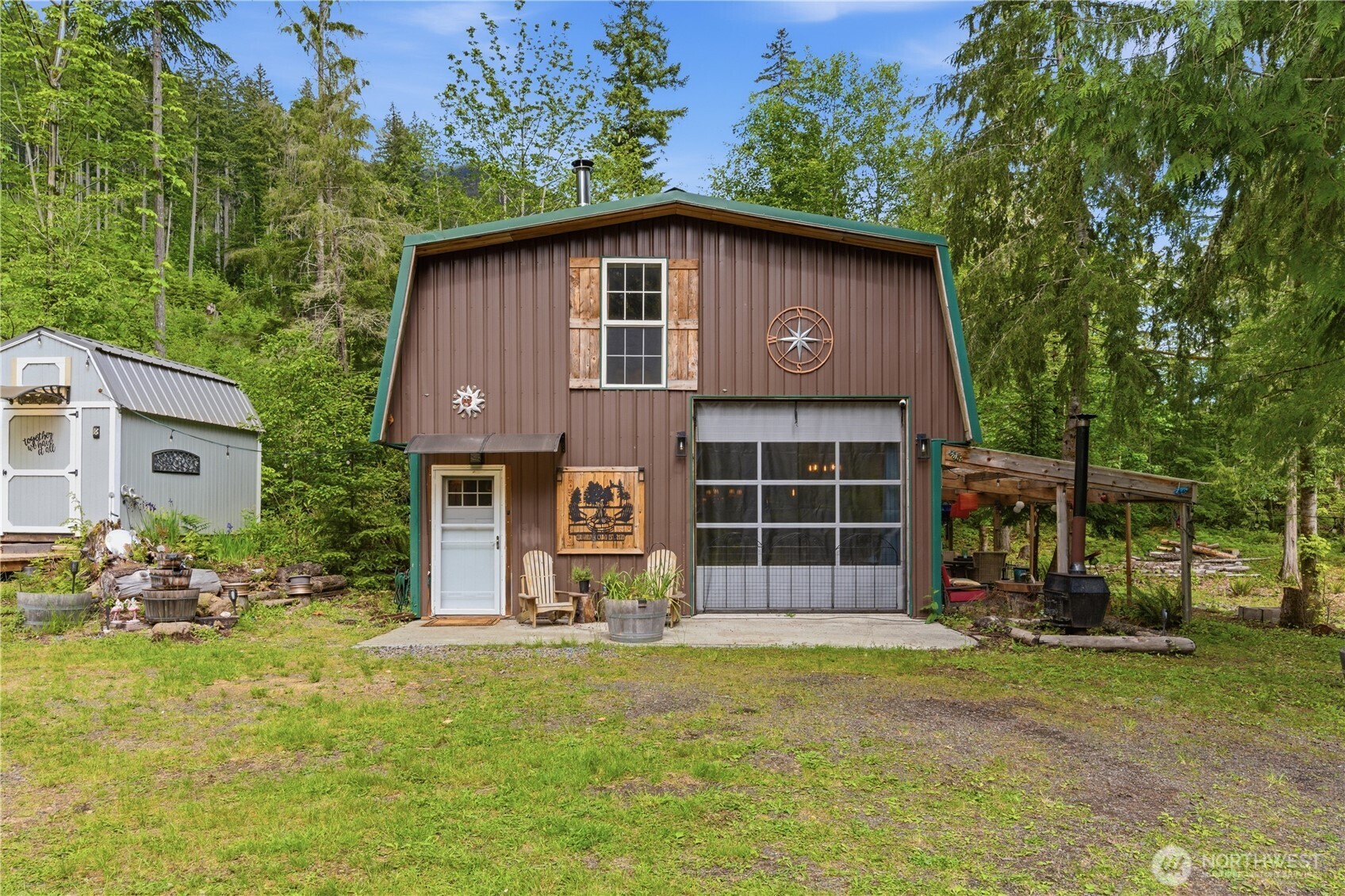 3320 Duckabush Road Brinnon, WA 98320 - Photo 1 of 38 a front view of a house with a yard