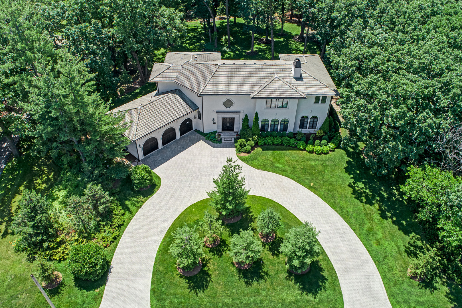 an aerial view of a house with a garden