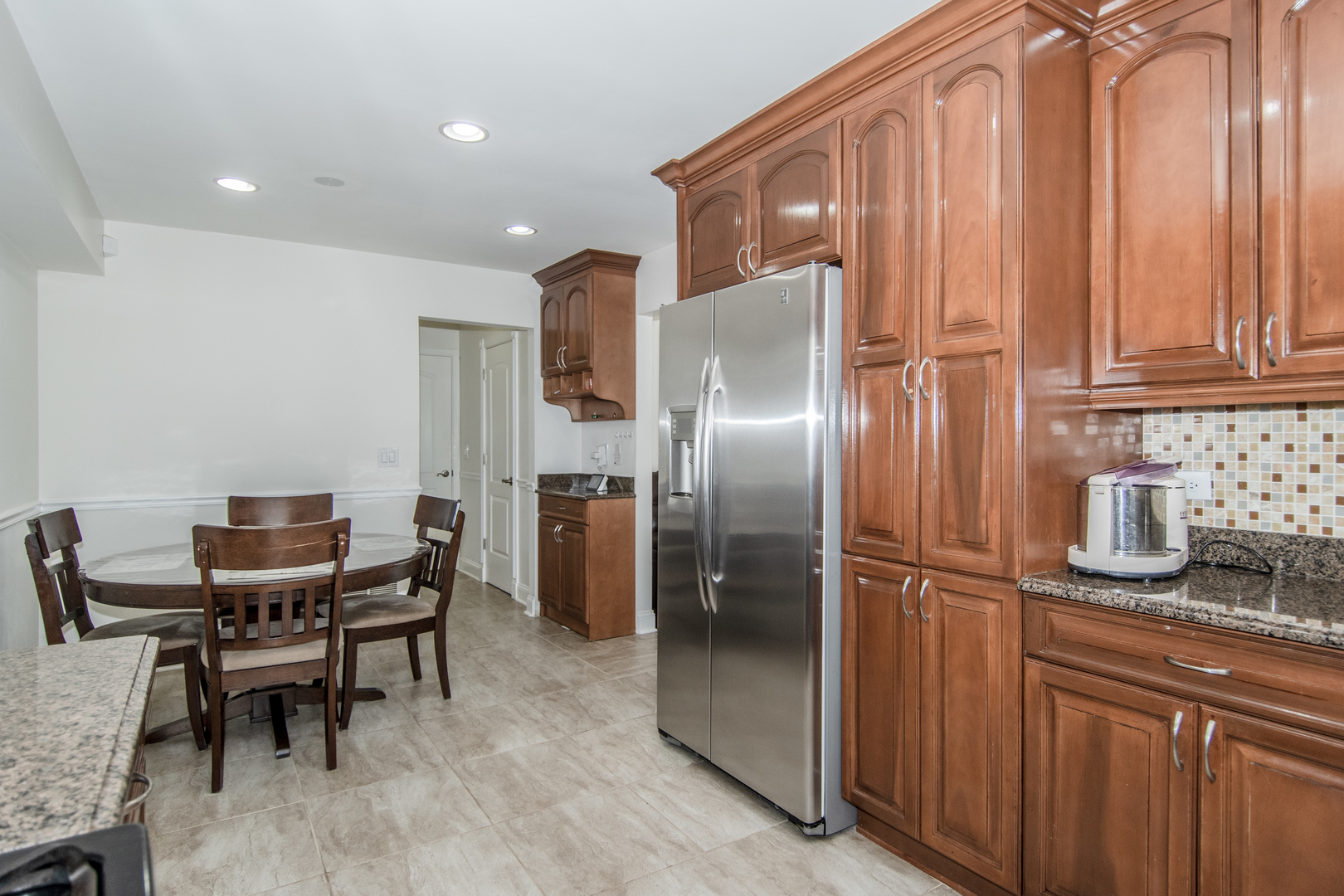 1144 Needham Road Naperville, IL 60563 - Photo 15 of 52 a kitchen with stainless steel appliances granite countertop a refrigerator and a sink
