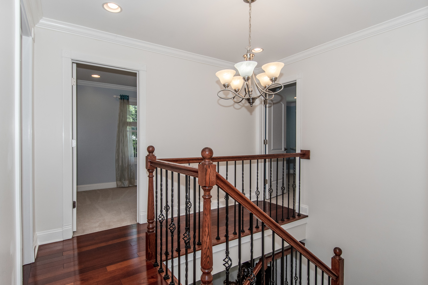 1144 Needham Road Naperville, IL 60563 - Photo 17 of 52 a view of a hallway with chandelier and entryway