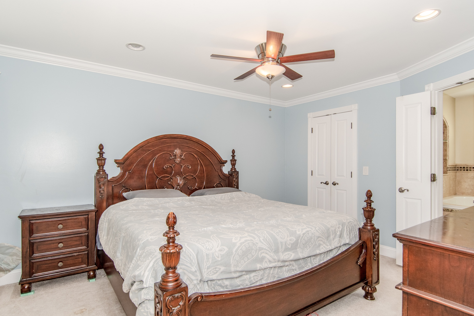 1144 Needham Road Naperville, IL 60563 - Photo 18 of 52 a bedroom with a bed and a chandelier