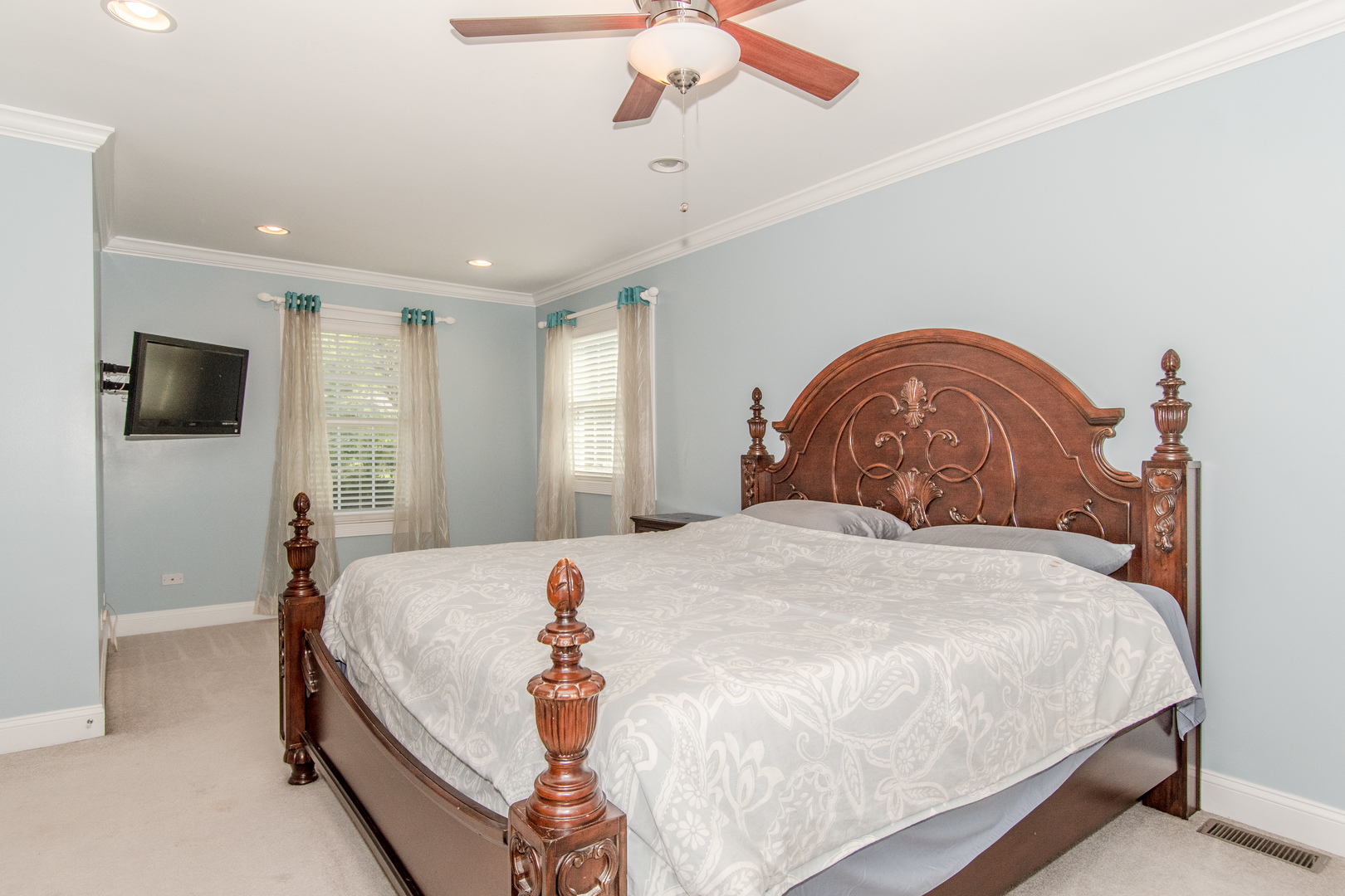 1144 Needham Road Naperville, IL 60563 - Photo 19 of 52 a bedroom with a bed and a flat screen tv