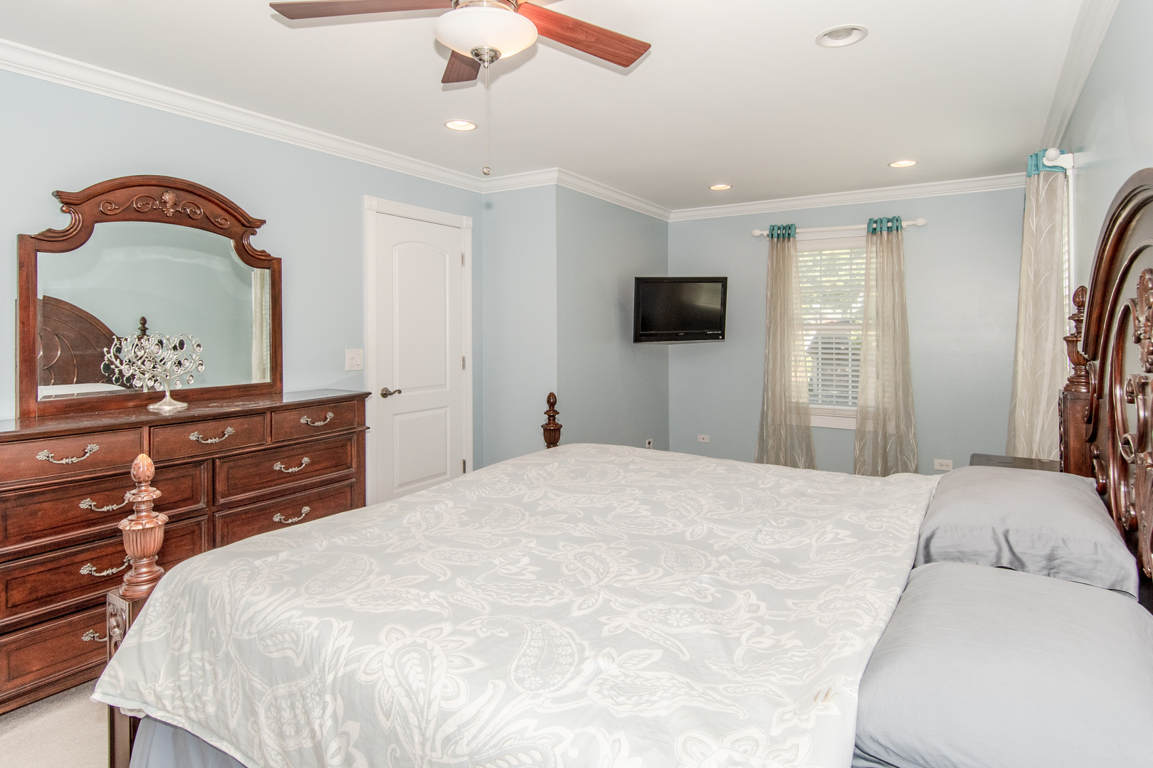 1144 Needham Road Naperville, IL 60563 - Photo 21 of 52 a bedroom with a bed and a flat screen tv