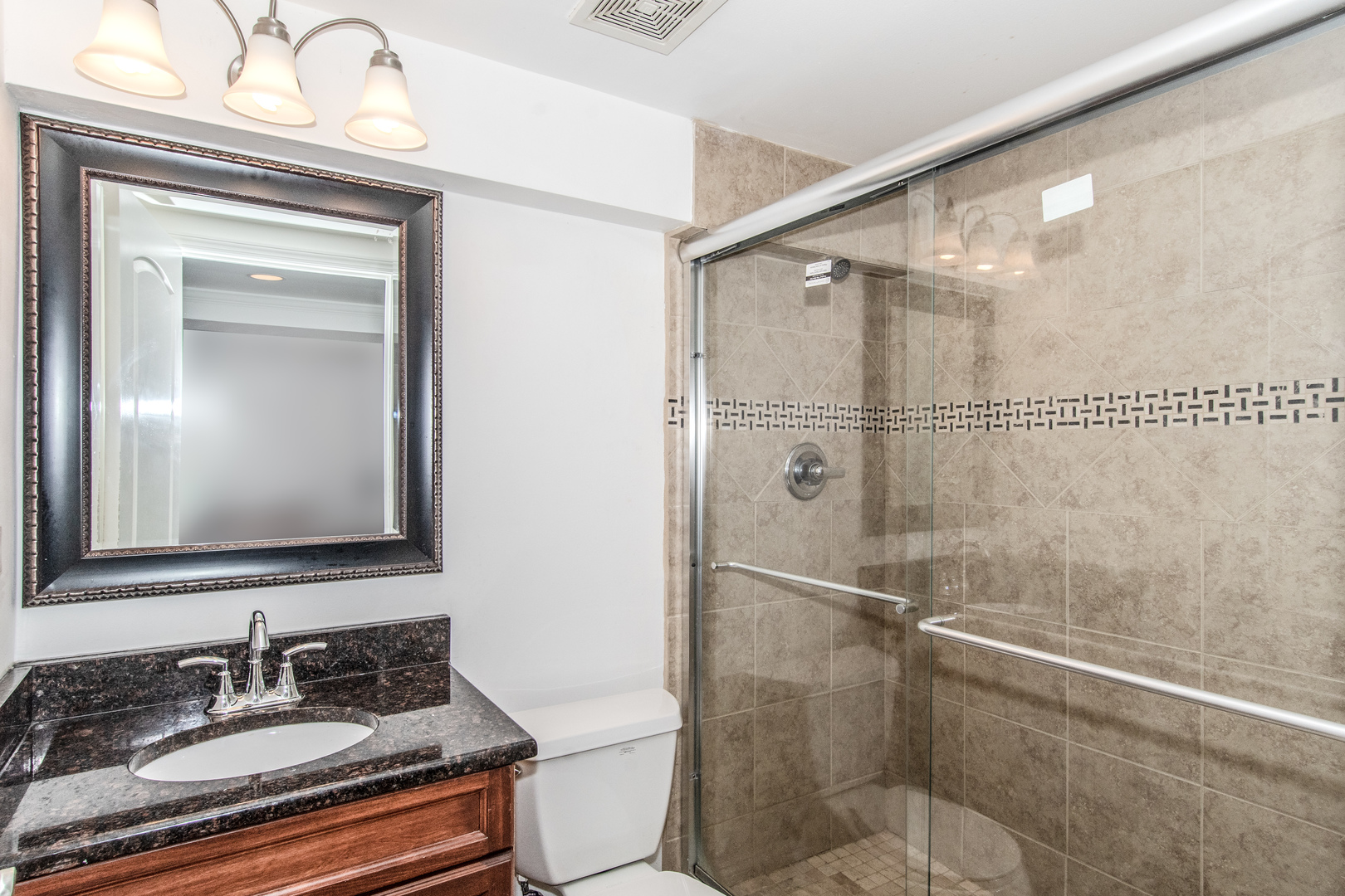 1144 Needham Road Naperville, IL 60563 - Photo 33 of 52 a bathroom with a granite countertop sink mirror vanity and toilet