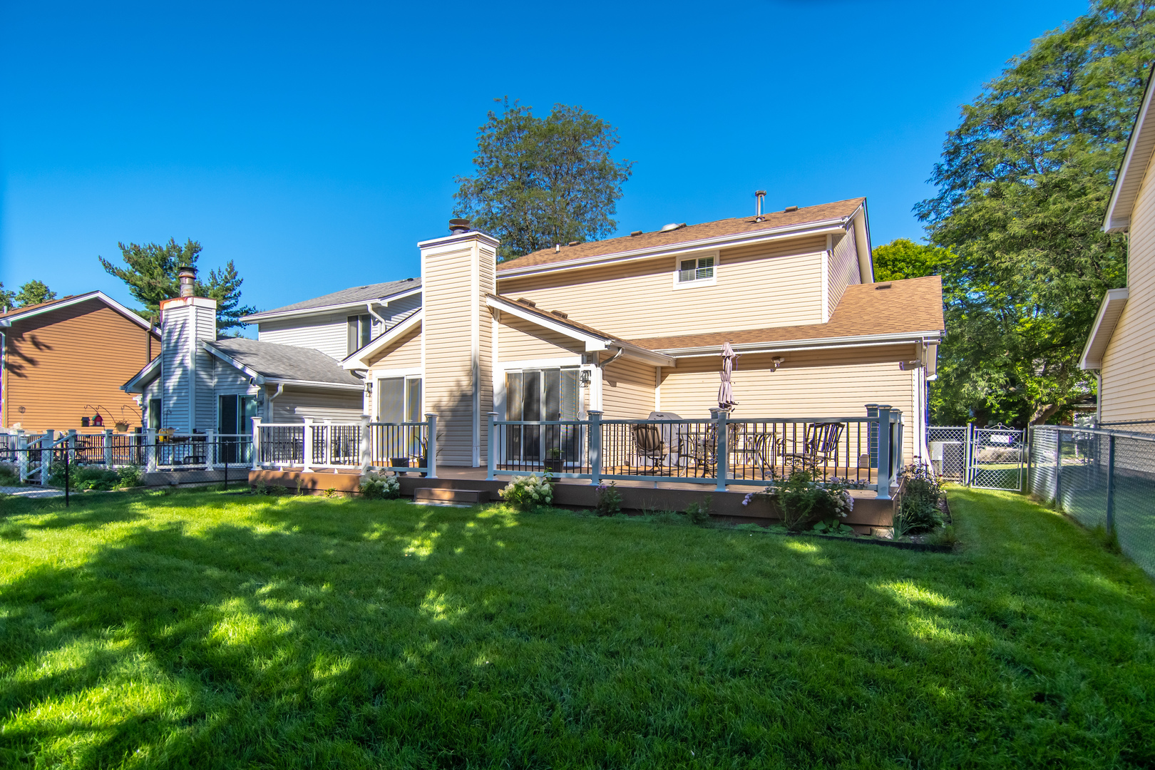 1144 Needham Road Naperville, IL 60563 - Photo 45 of 52 a view of a house with a backyard porch and sitting area