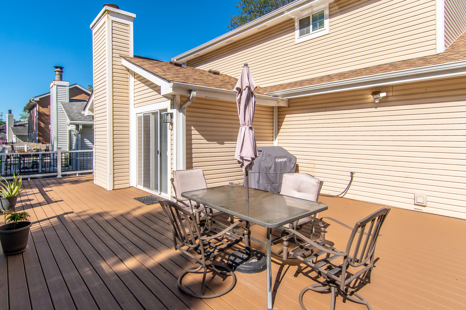 1144 Needham Road Naperville, IL 60563 - Photo 47 of 52 a backyard of a house with table and chairs