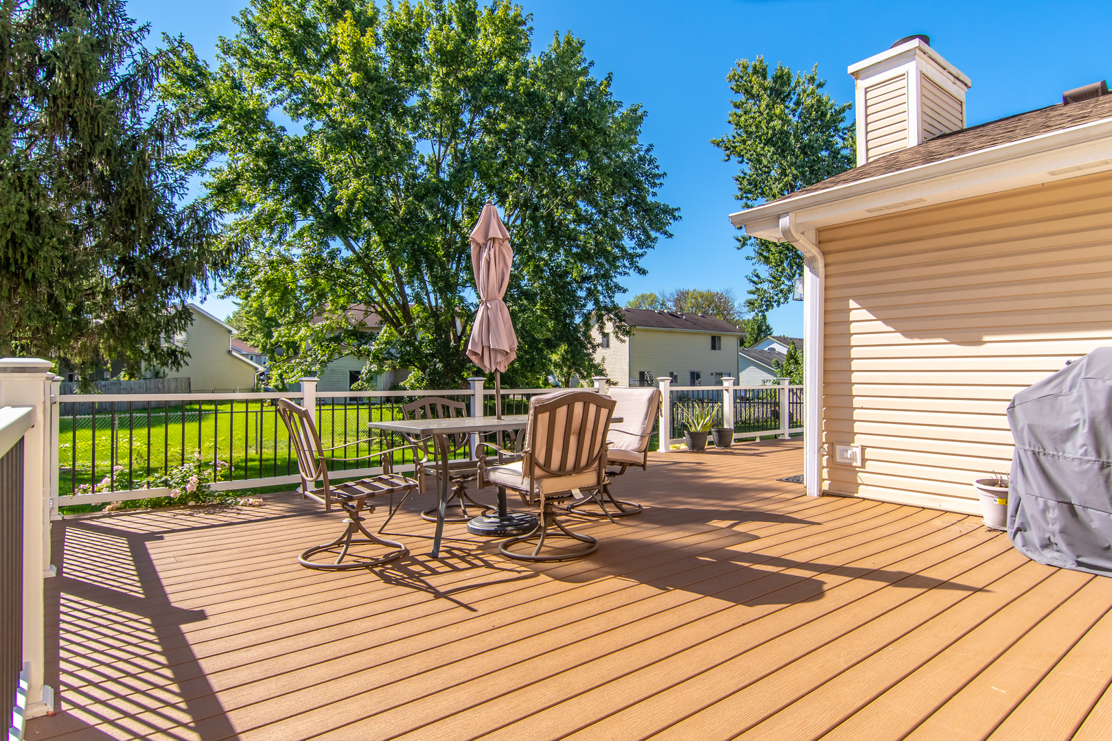 1144 Needham Road Naperville, IL 60563 - Photo 48 of 52 a view of a deck with wooden floor and outdoor seating