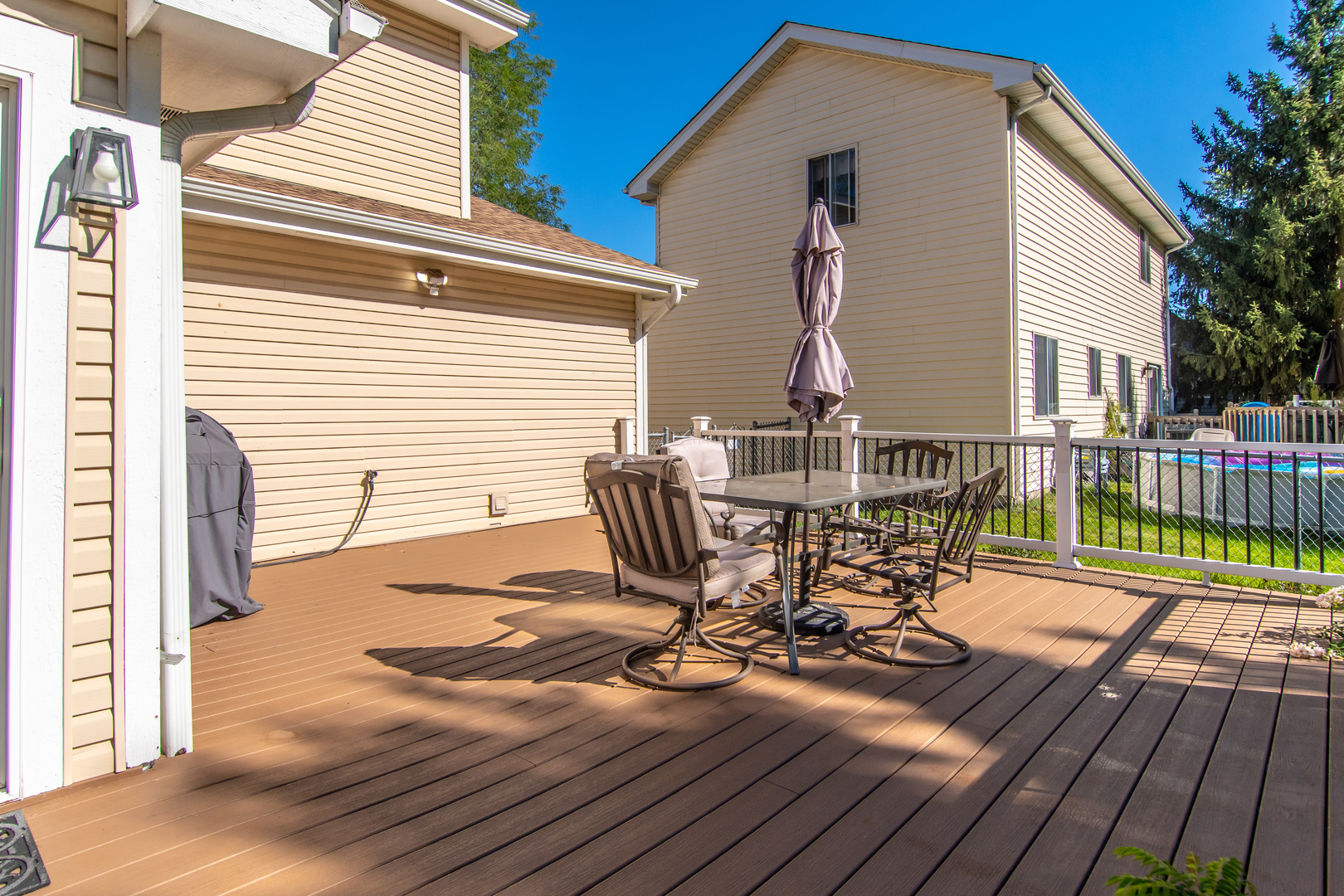 1144 Needham Road Naperville, IL 60563 - Photo 49 of 52 a view of a deck with wooden floor and outdoor seating