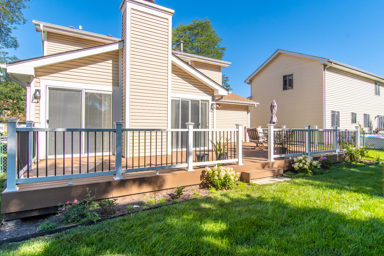 1144 Needham Road Naperville, IL 60563 - Photo 52 of 52 a front view of a house with a yard table and chairs