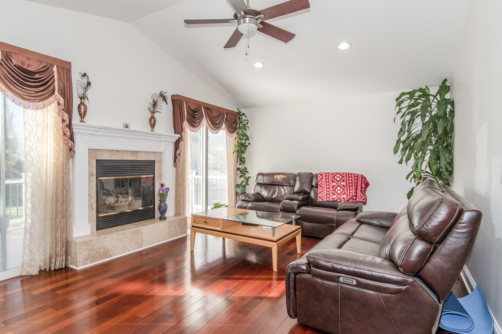 1144 Needham Road Naperville, IL 60563 - Photo 6 of 52 a living room with furniture a fireplace and a potted plant