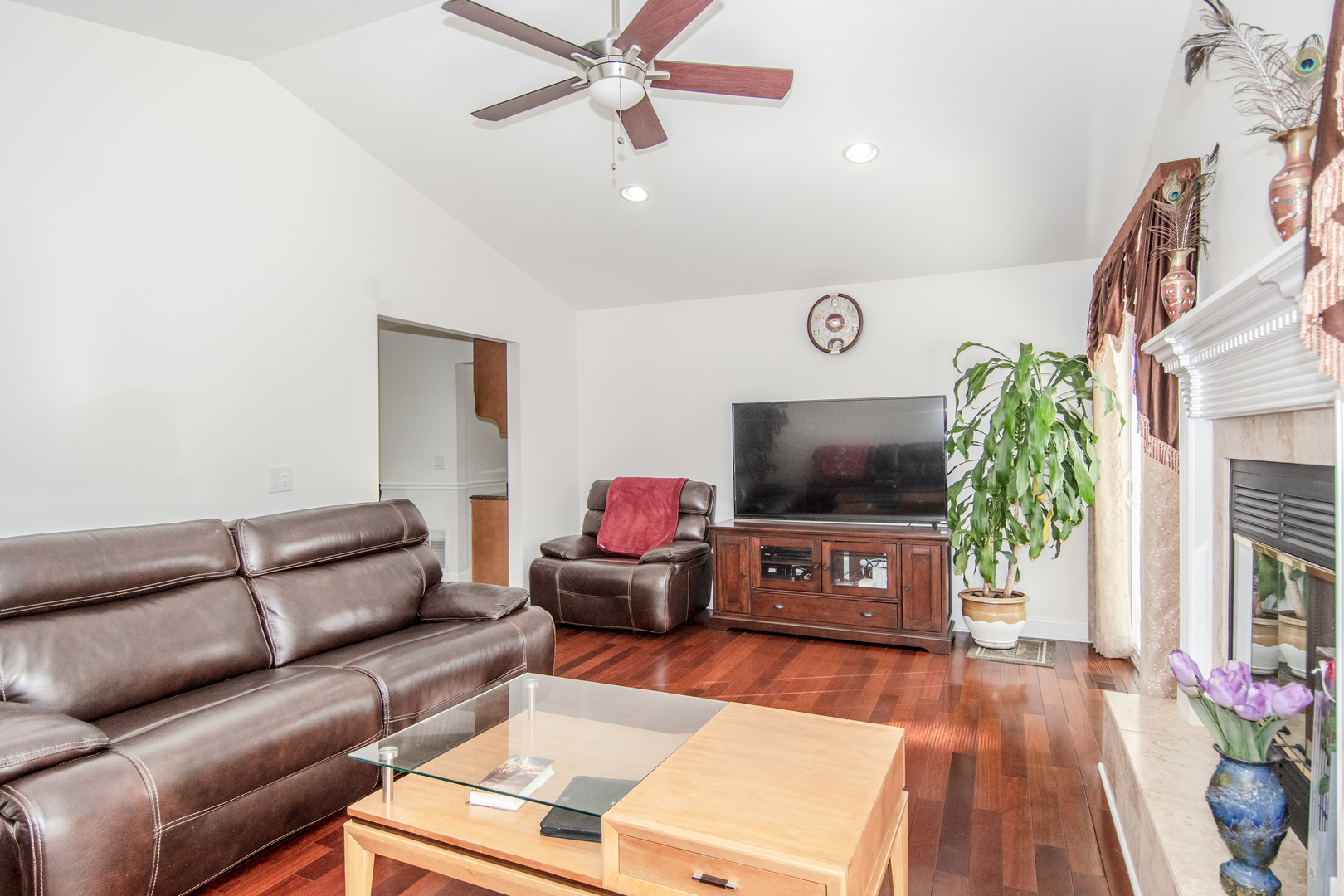 1144 Needham Road Naperville, IL 60563 - Photo 7 of 52 a living room with furniture and a flat screen tv