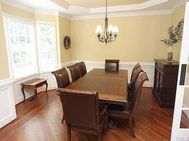 9121 Storrington Way Raleigh, NC 27615 - Photo 3 of 12 Separate Dining Room with Coffered Ceiling, Bay Window & Beautiful Hardwood Floors