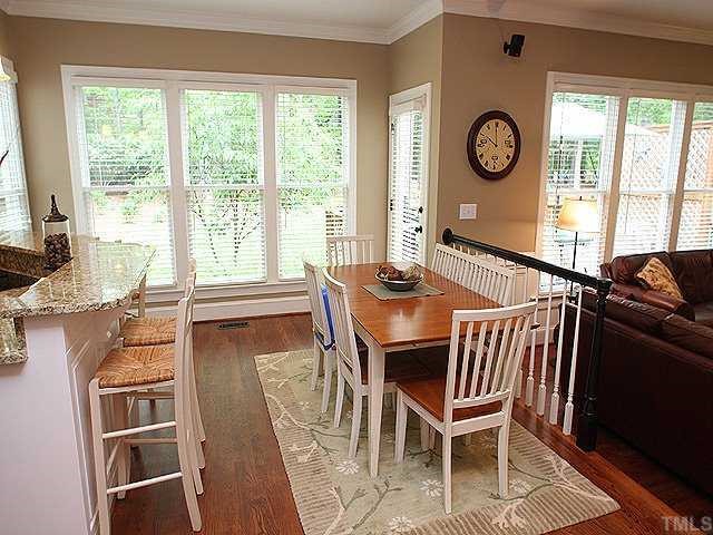 9121 Storrington Way Raleigh, NC 27615 - Photo 5 of 12 Breakfast Area w/Hardwood Flrs & Access to Deck