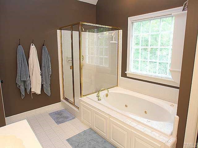 9121 Storrington Way Raleigh, NC 27615 - Photo 8 of 12 Master Bath w/Vaulted Ceiling, Double Sinks, Jet Tub, Shower, & Closeted Commode
