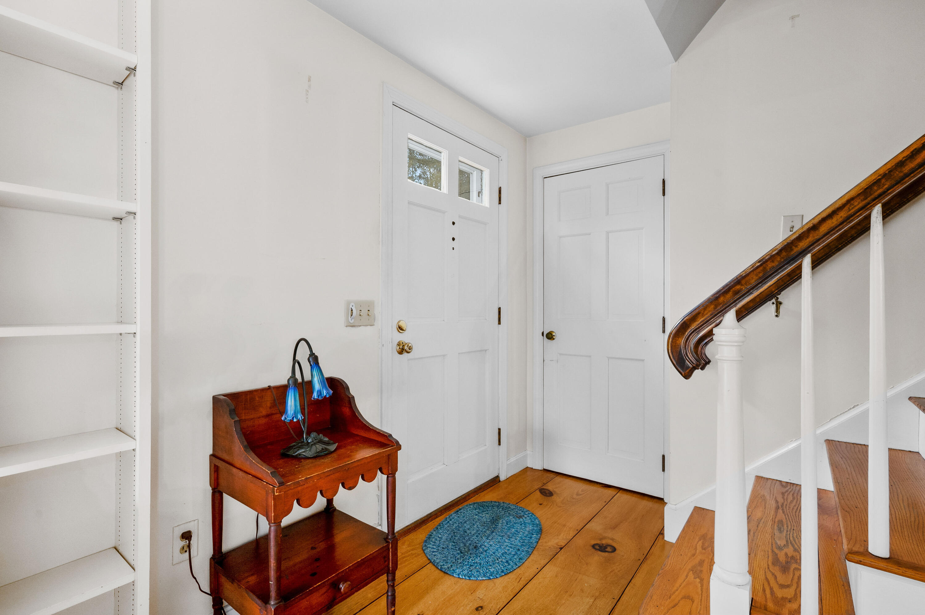 538 South Orleans Road Orleans, MA 02653 - Photo 15 of 35 a view of a hallway to a livingroom with furniture and staircase