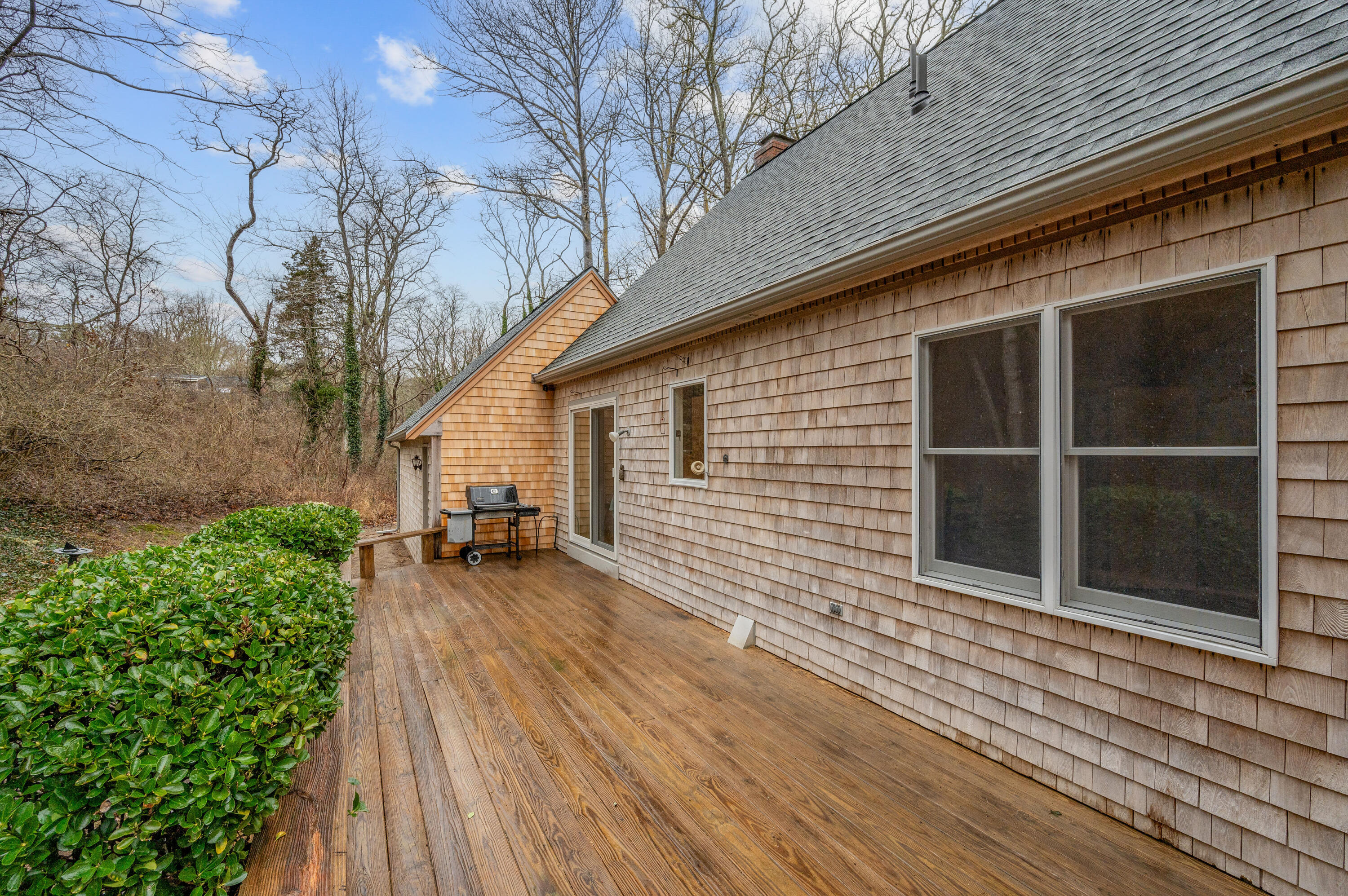 538 South Orleans Road Orleans, MA 02653 - Photo 8 of 35 a view of a house with a wooden deck and a backyard