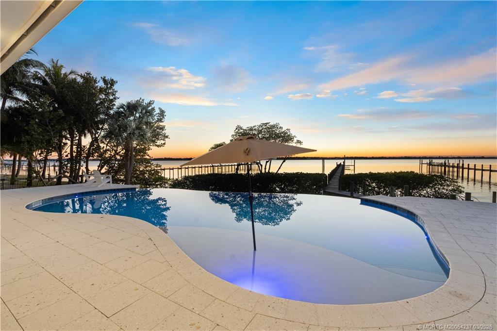 1912 Northwest Cove Circle Stuart, FL 34994 - Photo 12 of 24 a view of a swimming pool with a terrace