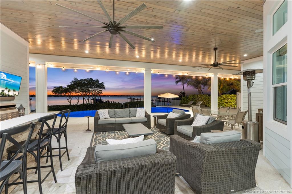 1912 Northwest Cove Circle Stuart, FL 34994 - Photo 15 of 24 a living room with furniture and a large window