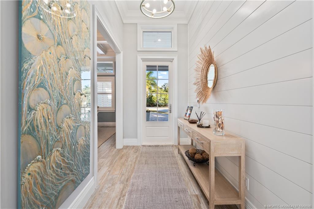 1912 Northwest Cove Circle Stuart, FL 34994 - Photo 5 of 24 a view of an entryway with wooden floor