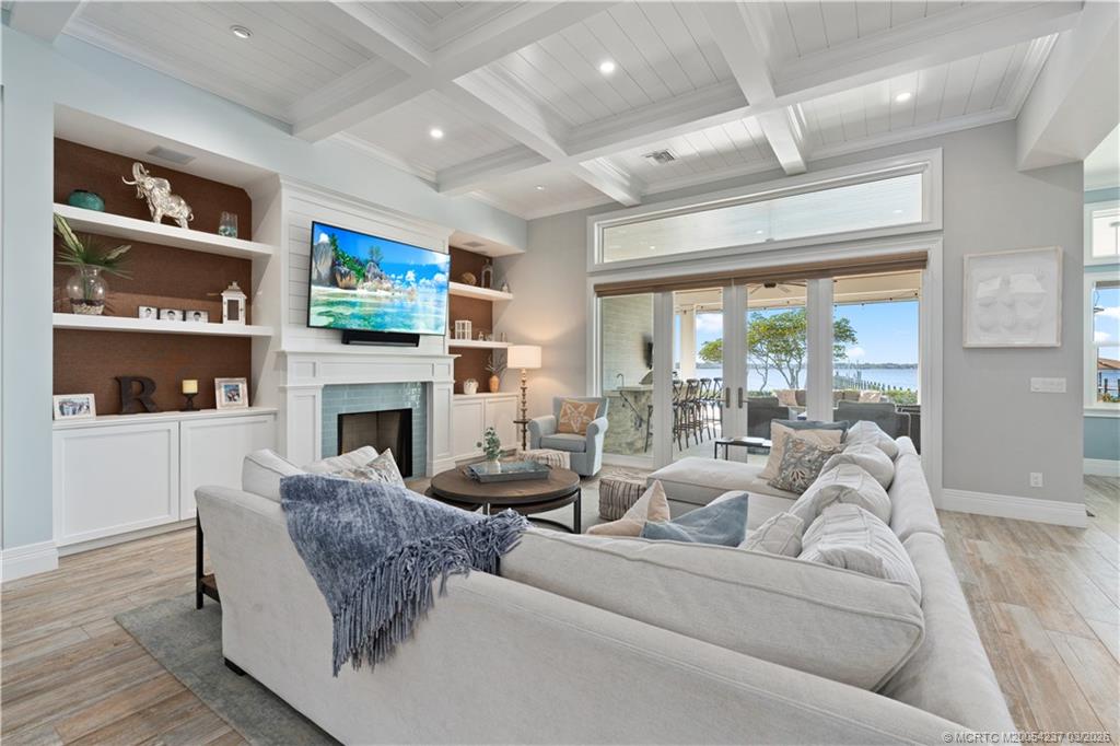 1912 Northwest Cove Circle Stuart, FL 34994 - Photo 6 of 24 a living room with furniture and a fireplace
