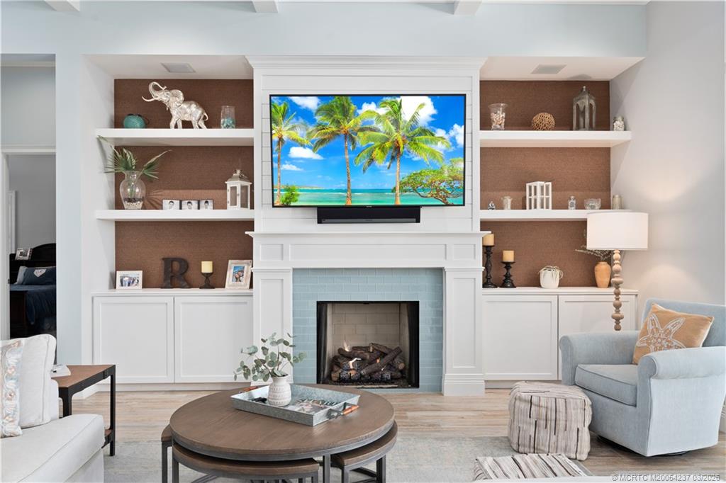 1912 Northwest Cove Circle Stuart, FL 34994 - Photo 7 of 24 a living room with furniture and a fireplace
