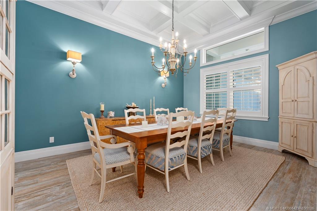 1912 Northwest Cove Circle Stuart, FL 34994 - Photo 10 of 24 a view of a dining room with furniture window and wooden floor