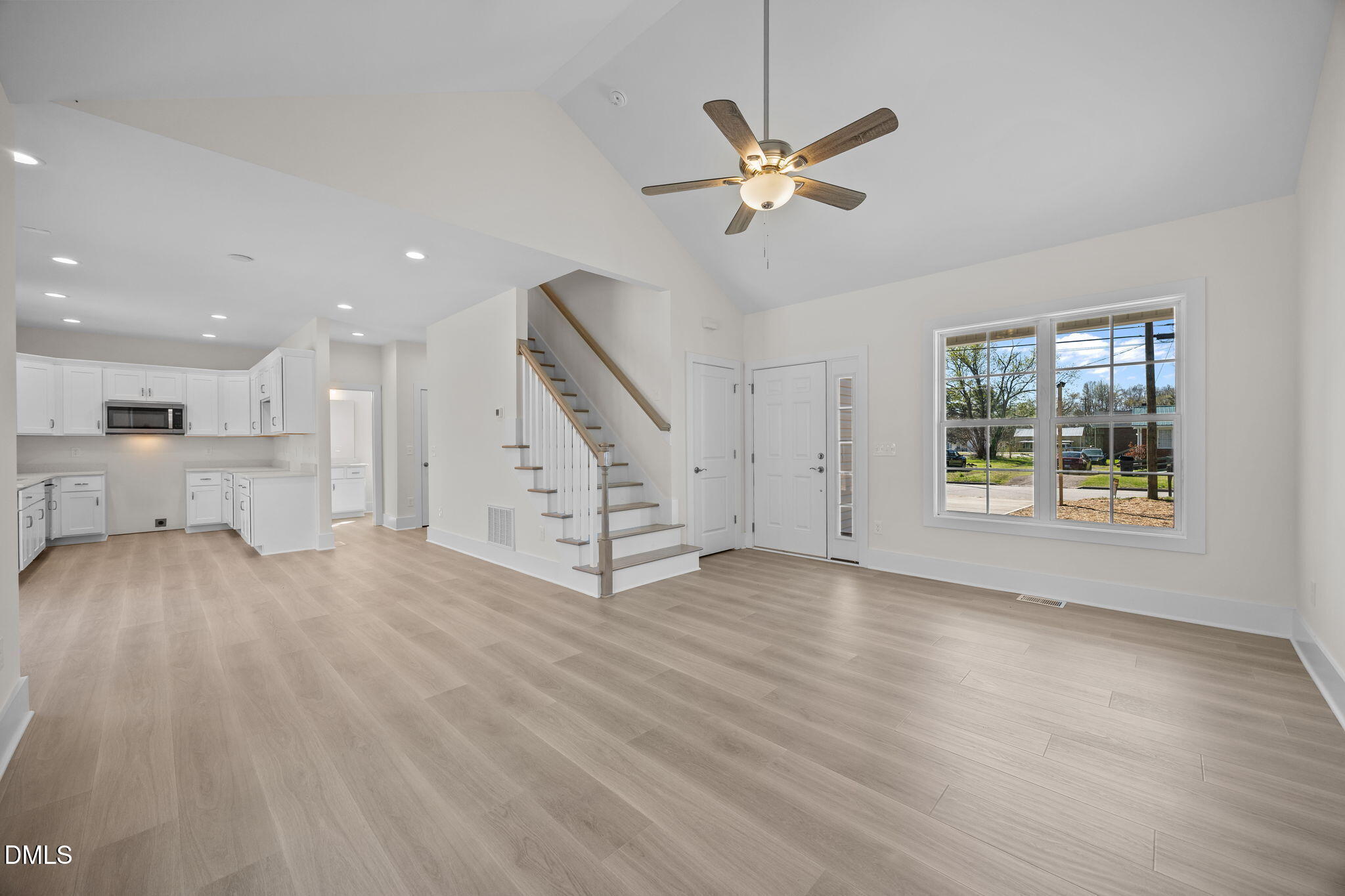 506 Hicks Mill Road Oxford, NC 27565 - Photo 2 of 15 a view of an empty room with a window and wooden floor