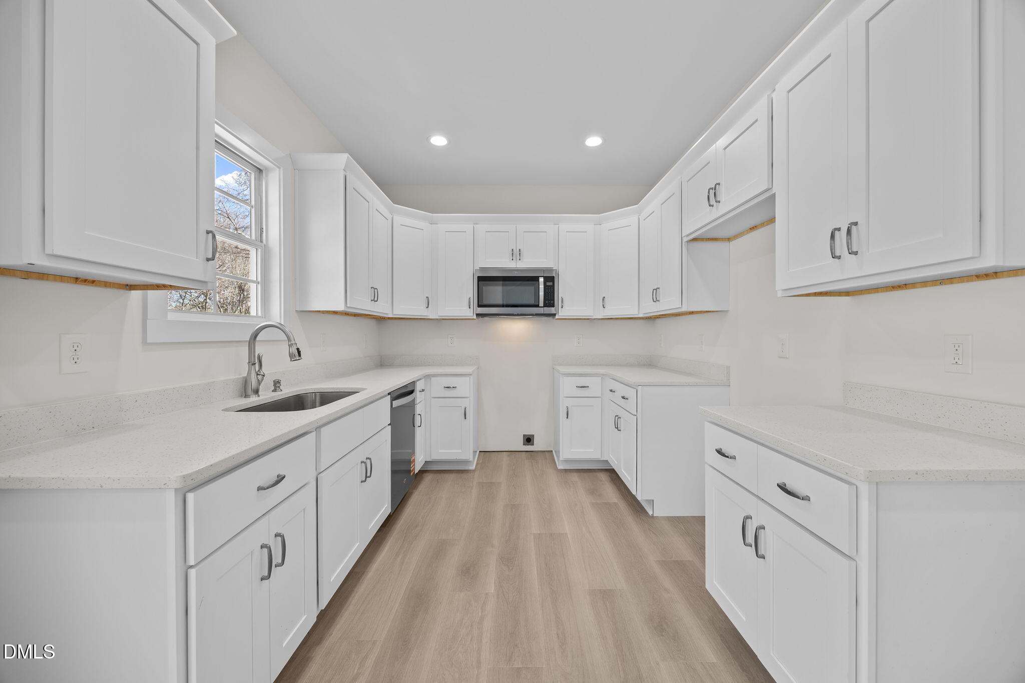 506 Hicks Mill Road Oxford, NC 27565 - Photo 4 of 15 a kitchen with white cabinets sink and stove