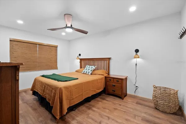 a bedroom with a bed and a chair