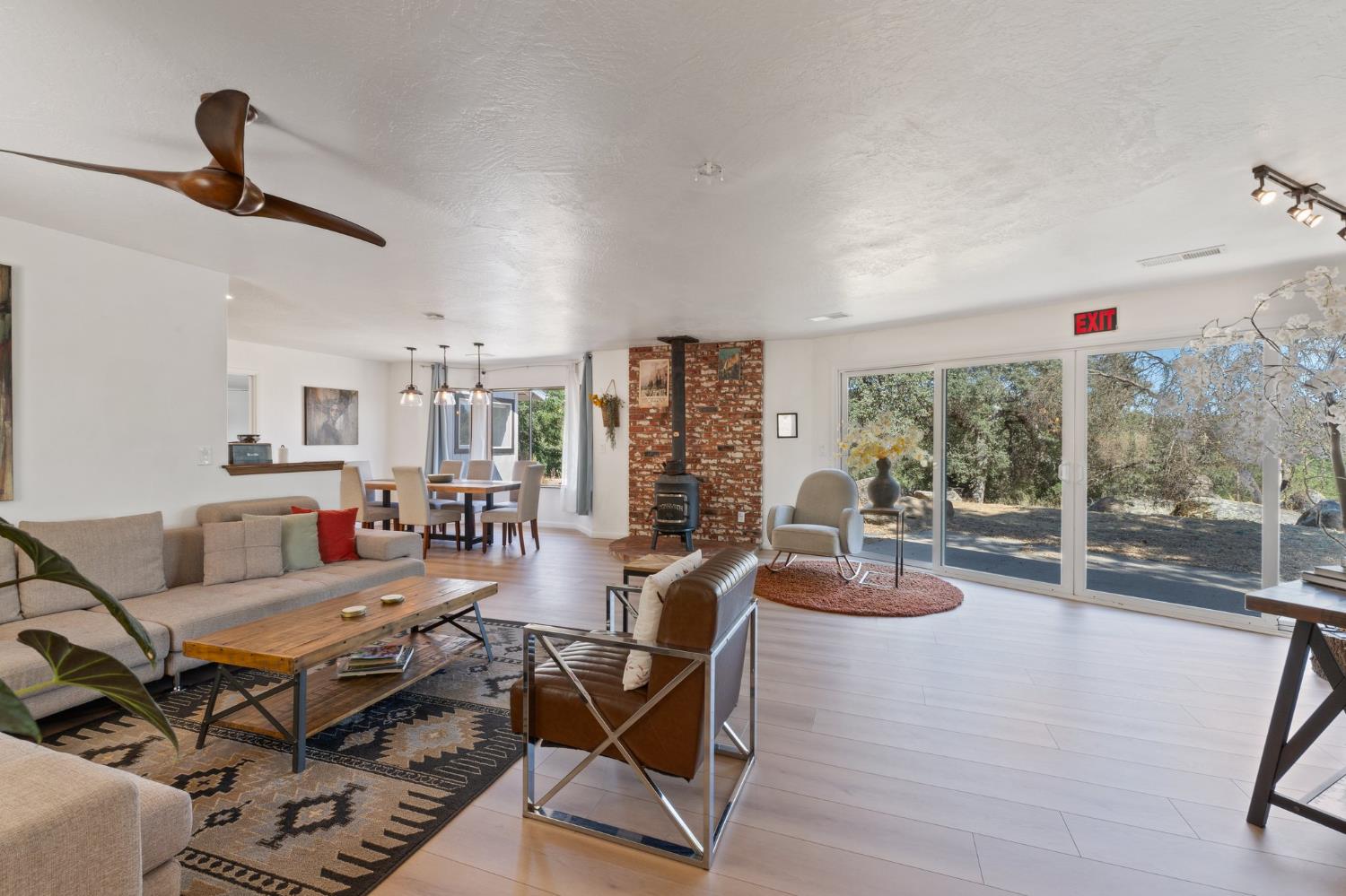 a living room with furniture and a floor to ceiling window