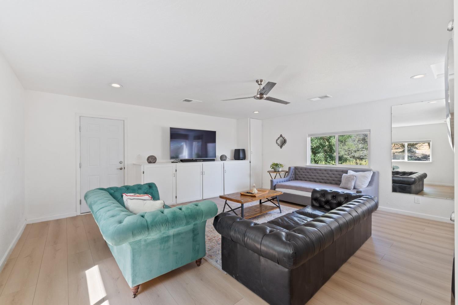 4577 Totokon Road Mariposa, CA 95338 - Photo 15 of 57 a living room with furniture and a flat screen tv