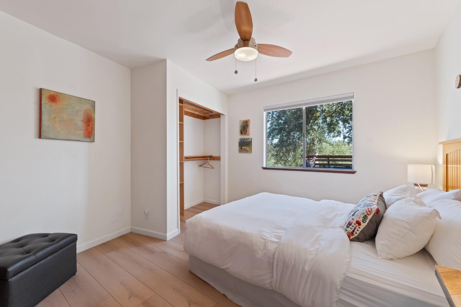 4577 Totokon Road Mariposa, CA 95338 - Photo 19 of 57 a bedroom with a bed and a window