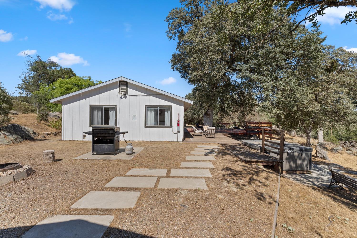 4577 Totokon Road Mariposa, CA 95338 - Photo 35 of 57 a view of a house with backyard and sitting area