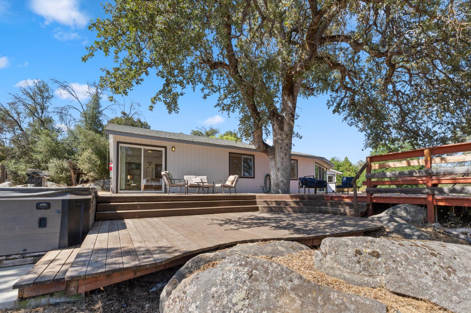 4577 Totokon Road Mariposa, CA 95338 - Photo 44 of 57 a house view with a sitting space fire pit and outdoor space