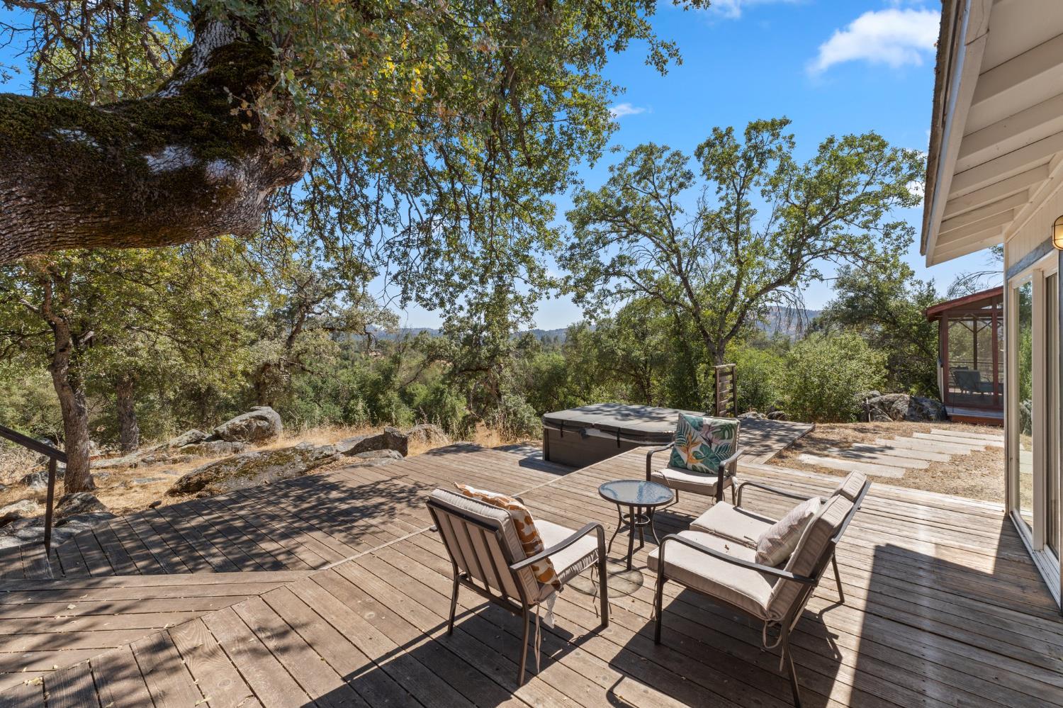 4577 Totokon Road Mariposa, CA 95338 - Photo 47 of 57 a view of a patio with table and chairs and floor to ceiling window
