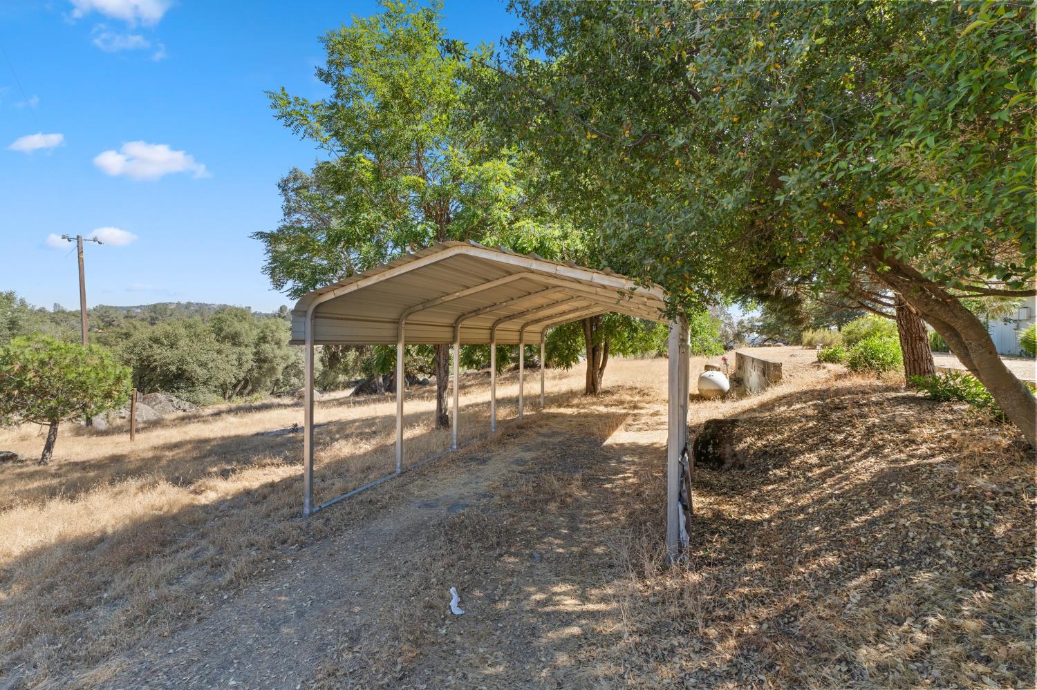 4577 Totokon Road Mariposa, CA 95338 - Photo 48 of 57 a table and chairs under an umbrella