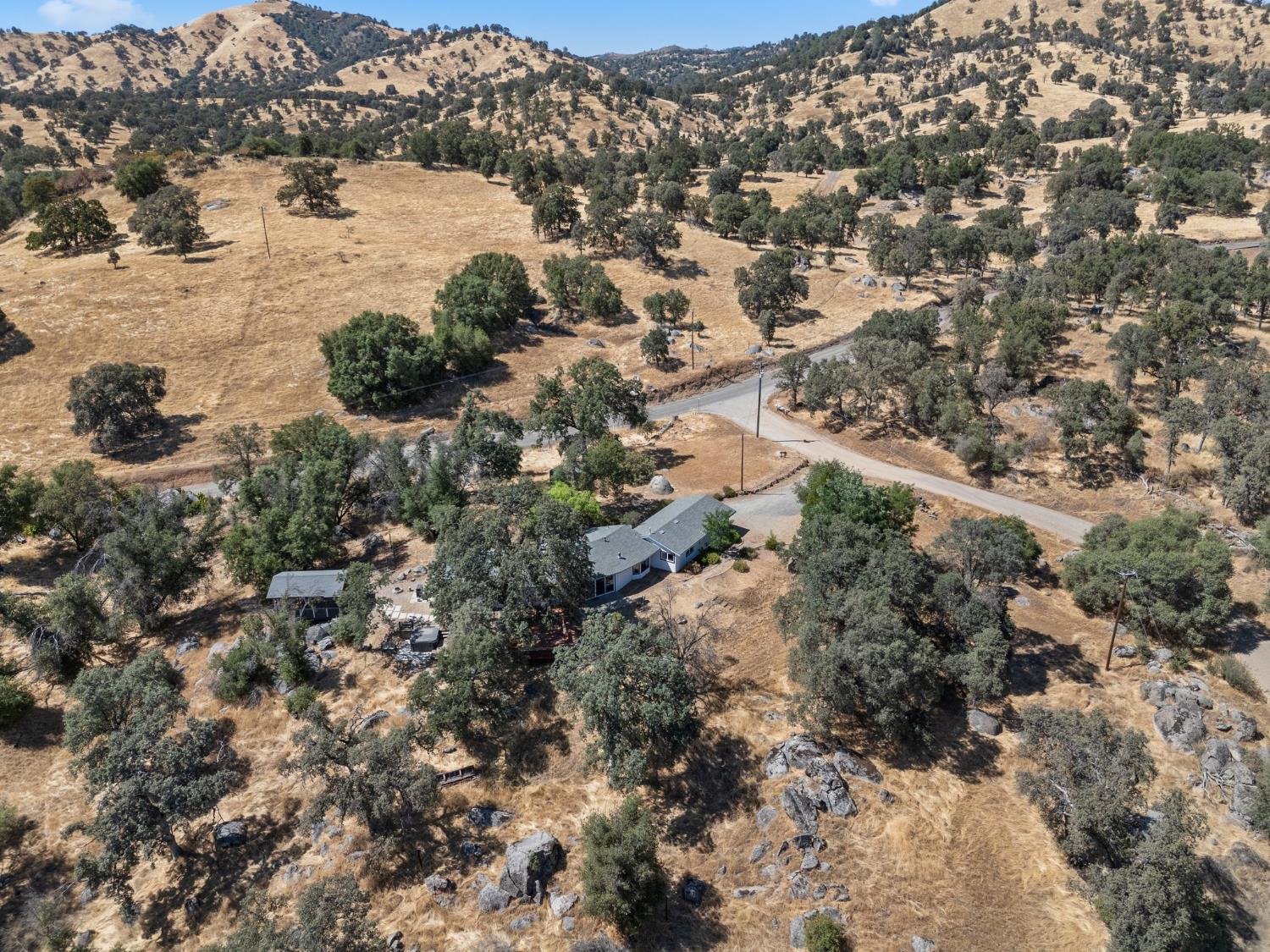 4577 Totokon Road Mariposa, CA 95338 - Photo 51 of 57 a view of a lake with lots of trees