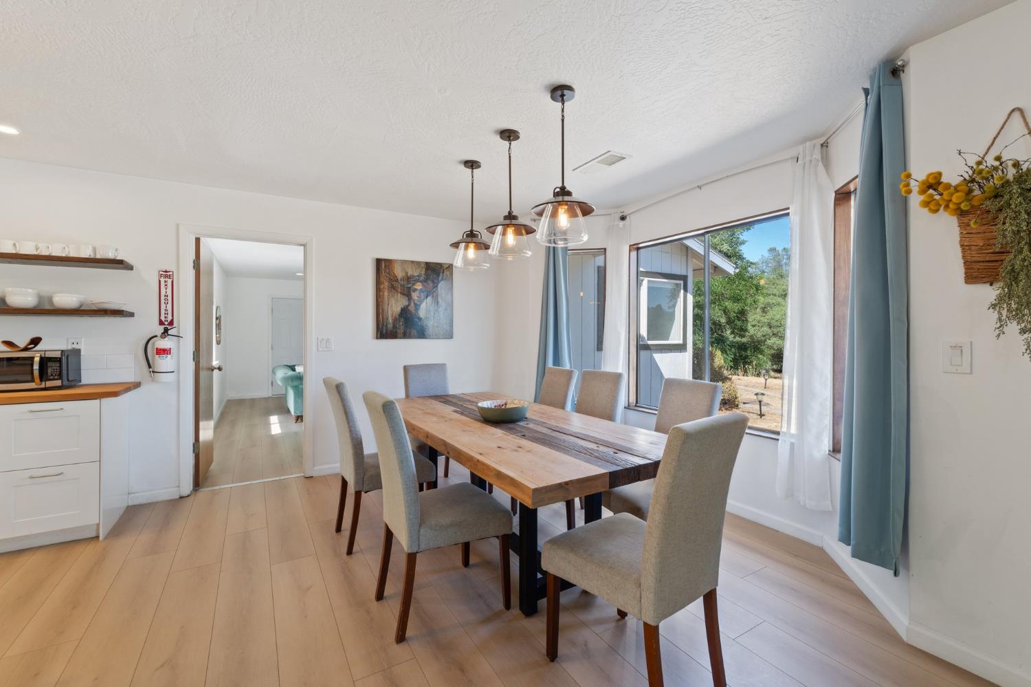 4577 Totokon Road Mariposa, CA 95338 - Photo 9 of 57 a view of a dining room with furniture window and wooden floor