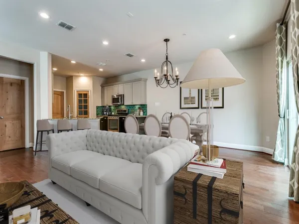 a view of a kitchen with a sink and cabinets