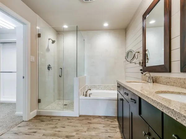 an empty room with fan and entrance