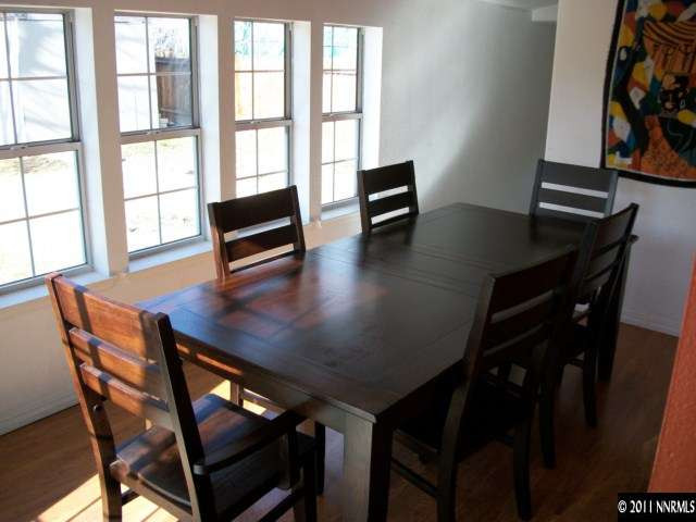 939 Lester Avenue Reno, NV 89502 - Photo 3 of 9 a view of a dining room with furniture and wooden floor