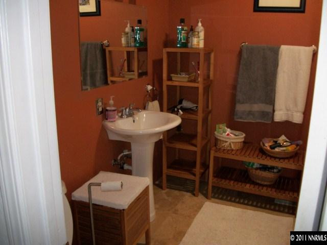 939 Lester Avenue Reno, NV 89502 - Photo 6 of 9 a bathroom with a sink and a mirror