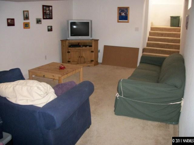 939 Lester Avenue Reno, NV 89502 - Photo 7 of 9 a living room with furniture and a flat screen tv