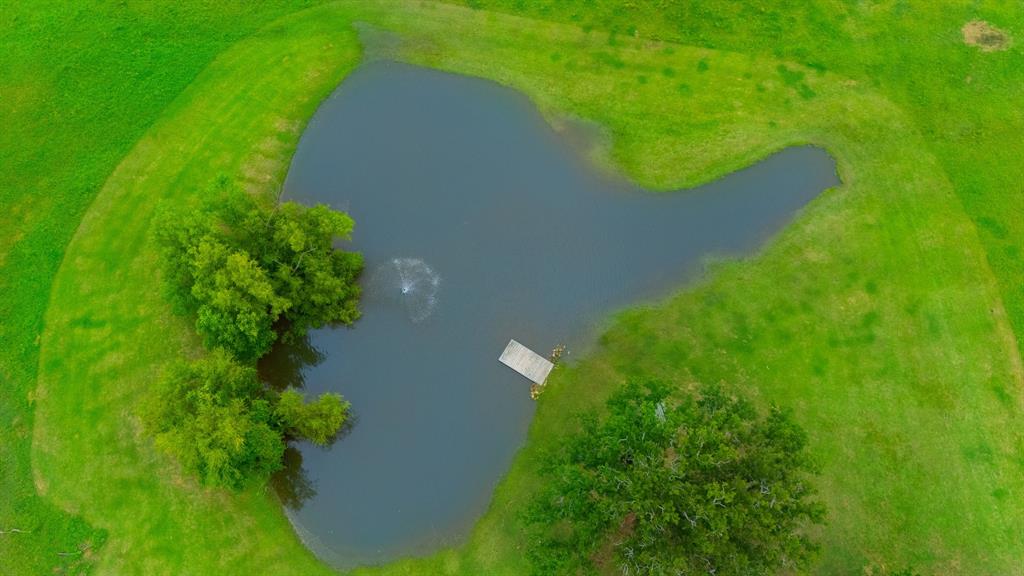 Tbd Bridle Bit Road Flower Mound, TX 75022 - Photo 8 of 24 Stocked pond with fountain and pier.