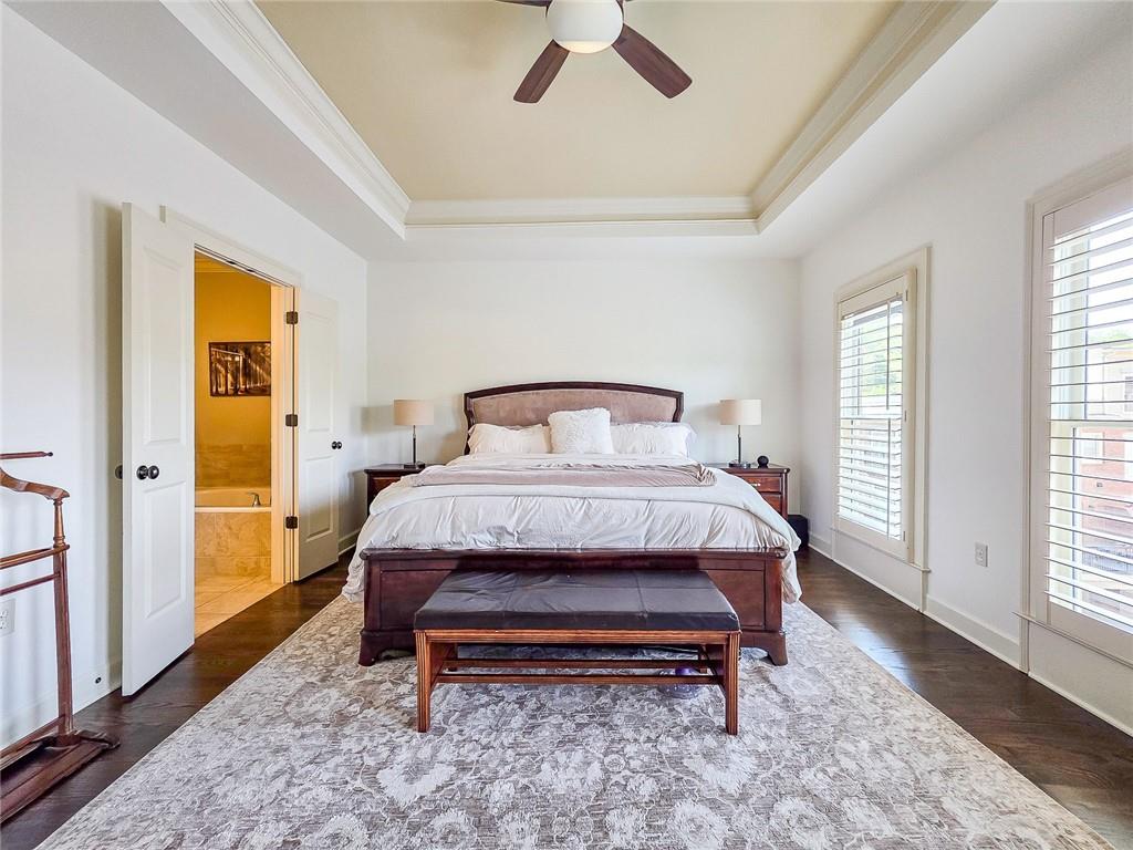 302 Riversgate Drive, Unit 55 Atlanta, GA 30339 - Photo 12 of 40 a bed sitting in a bedroom next to a window